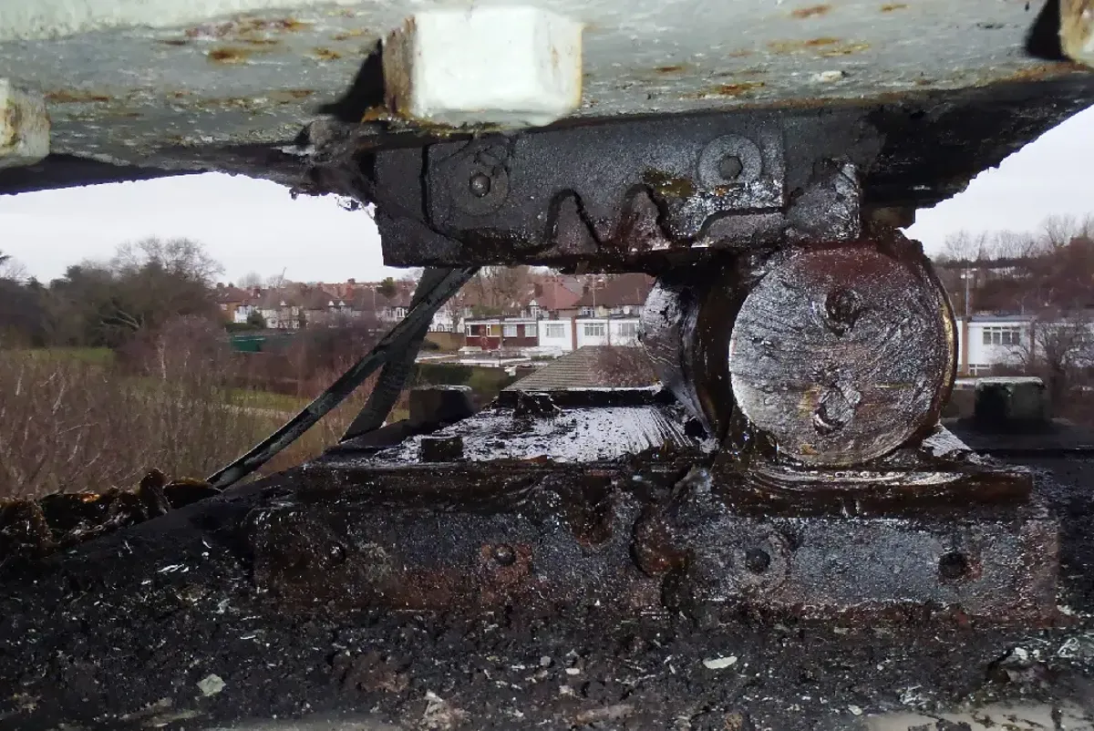 A car with a broken front wheel.