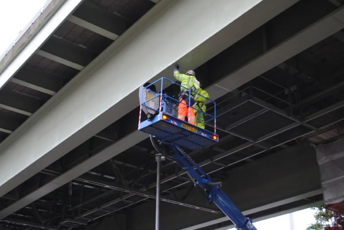 A few men on a roller coaster.