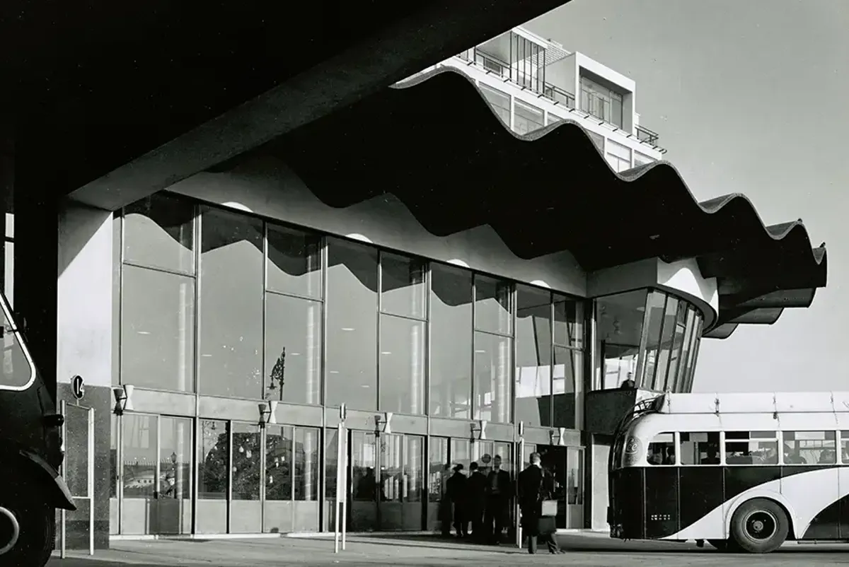 People queuing for a bus outside Busáras