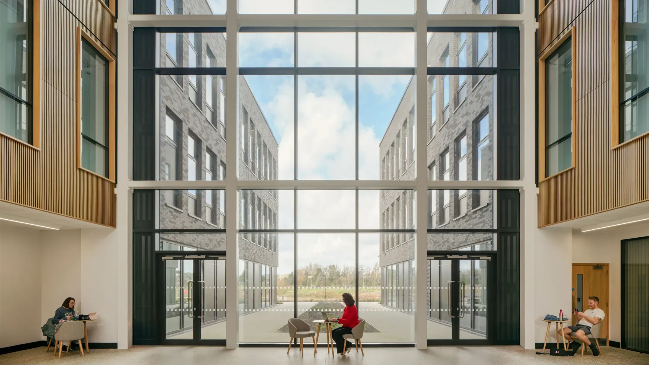 People sitting at tables in a building.