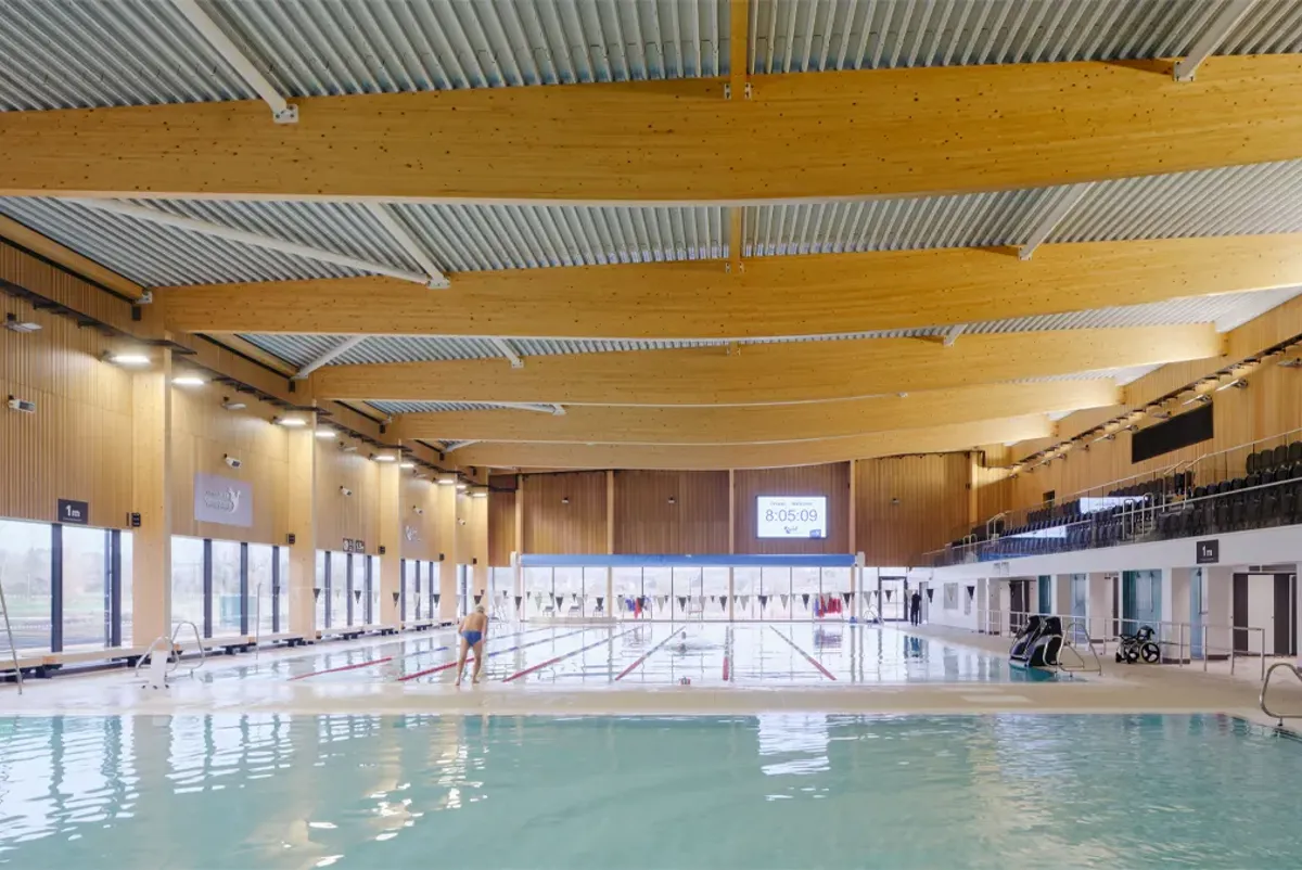 A swimming pool with a person sitting in it.