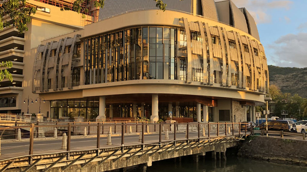 A building with a bridge over water.