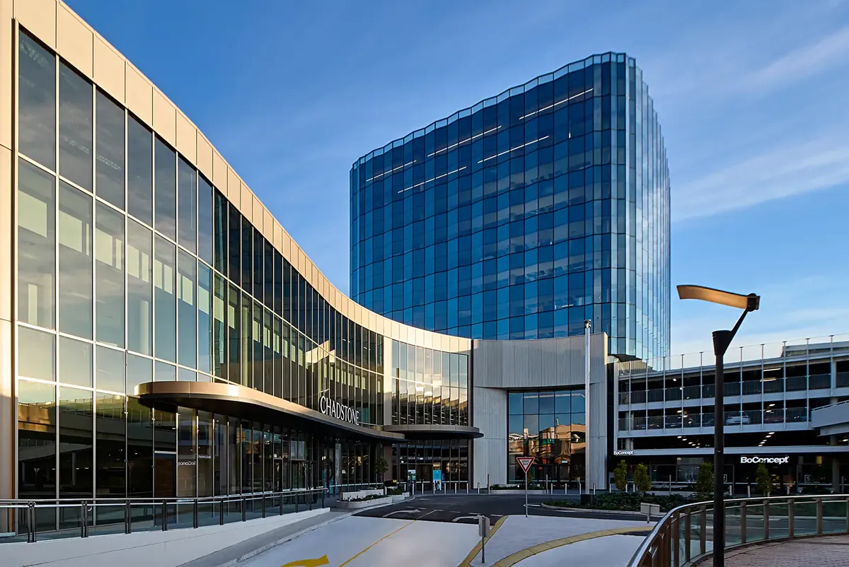 A building with glass windows and tower