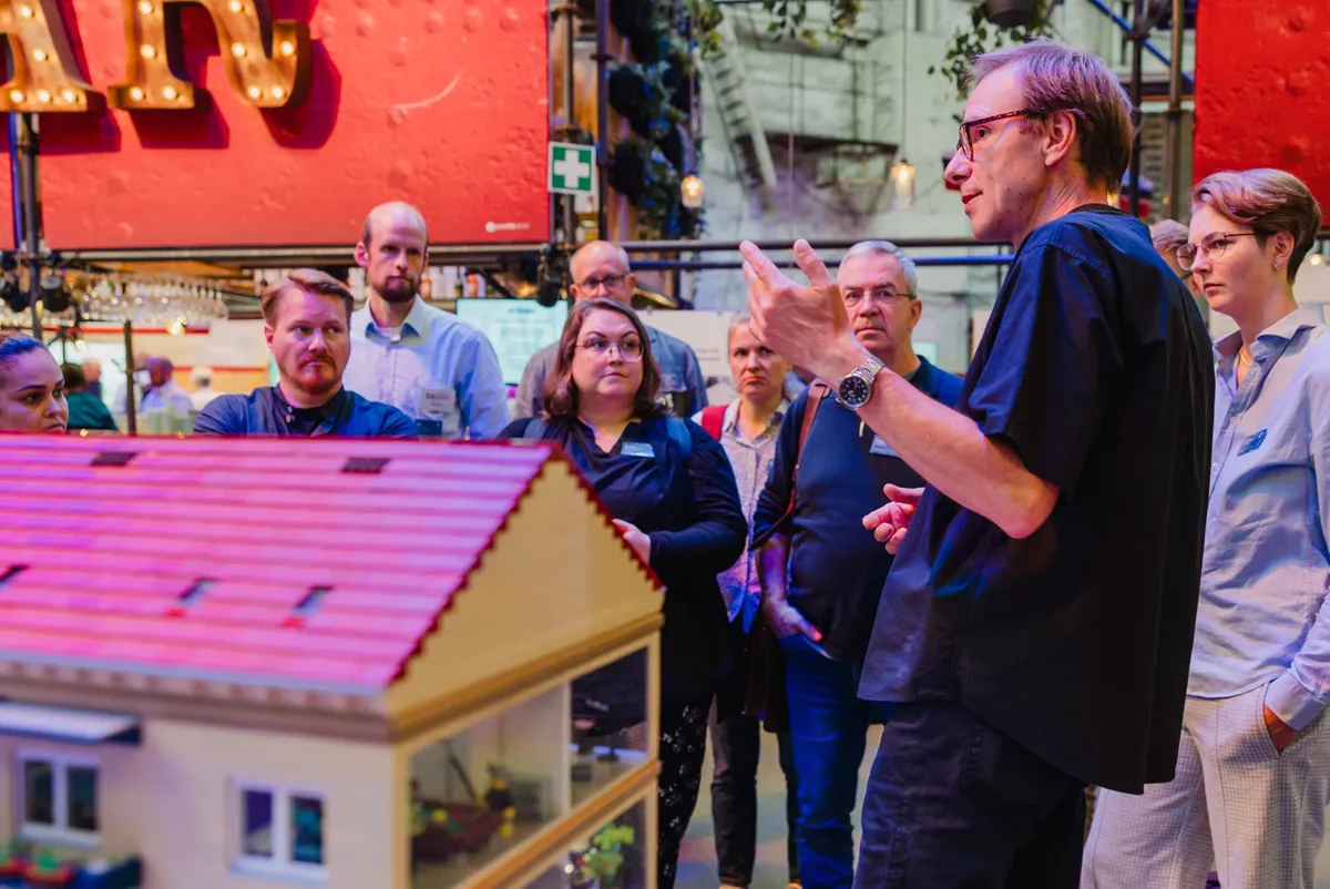 A group of people standing outside.