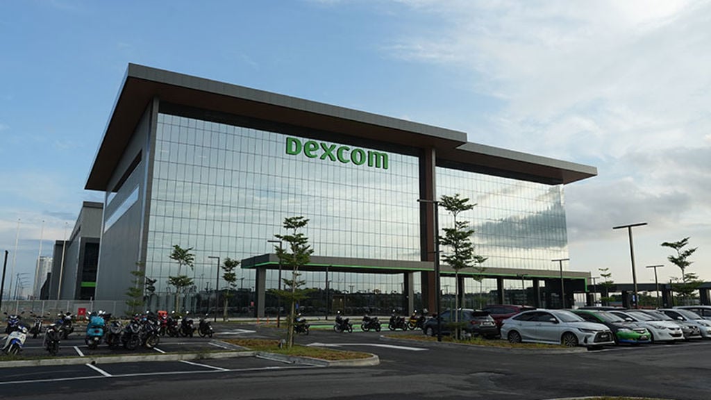 A large building with a parking lot.