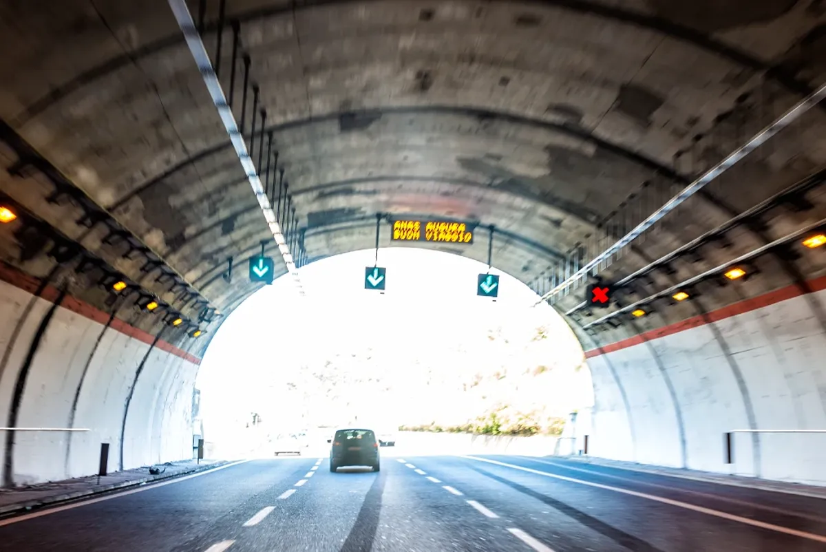 A car driving through a tunnel.