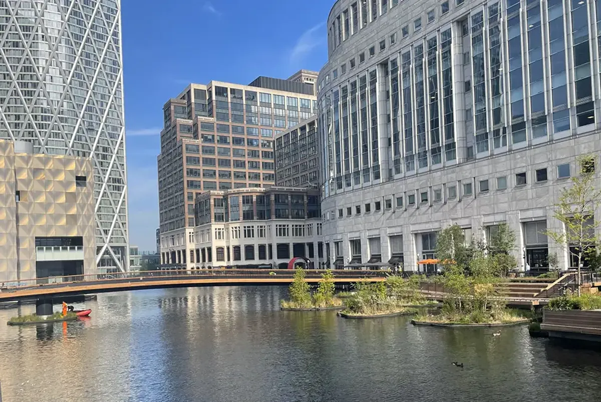 A body of water with buildings around it.