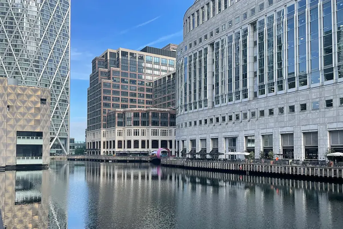 A body of water with buildings around it.