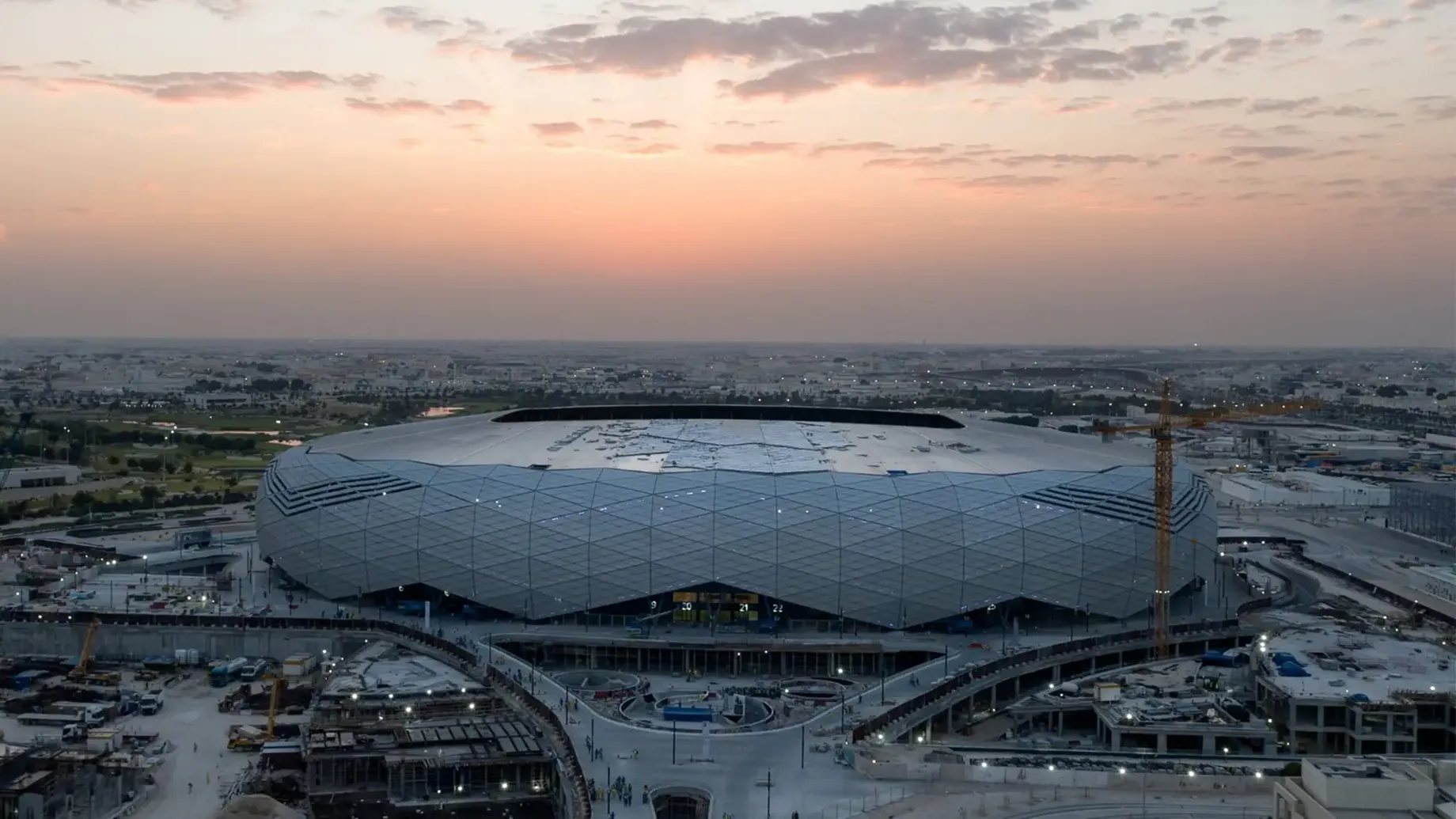 A large stadium with a large roof.