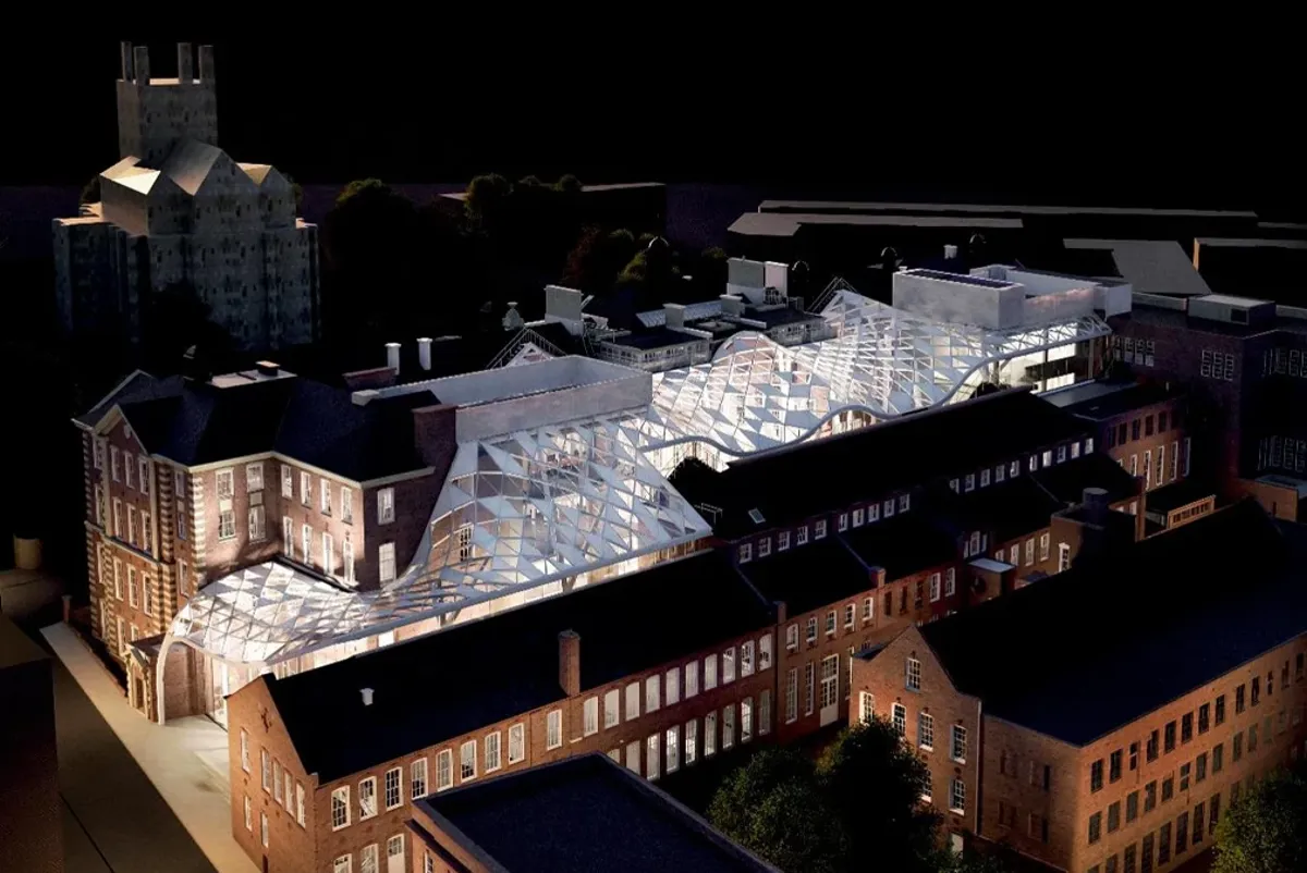 A group of buildings with a black sky.