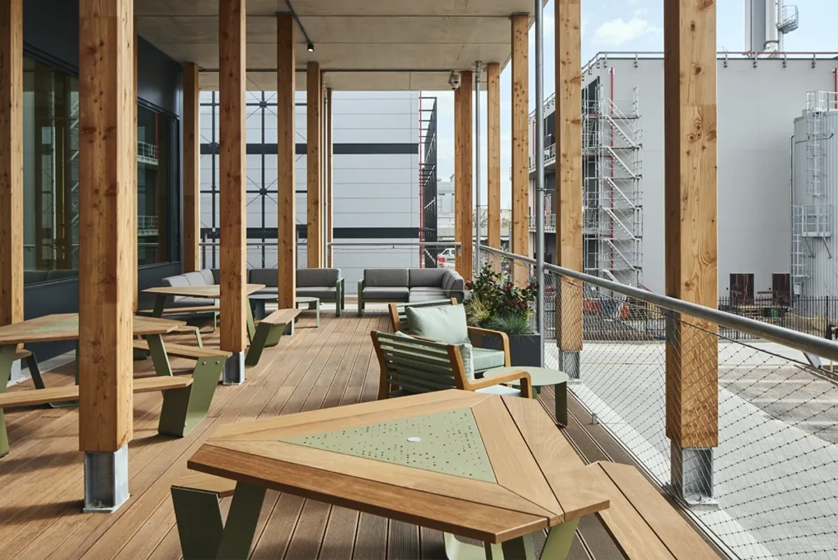 A deck with tables and chairs.