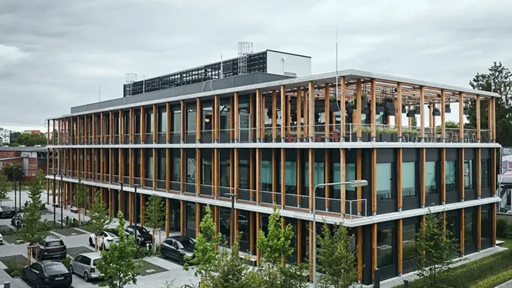 A building with cars parked in front.