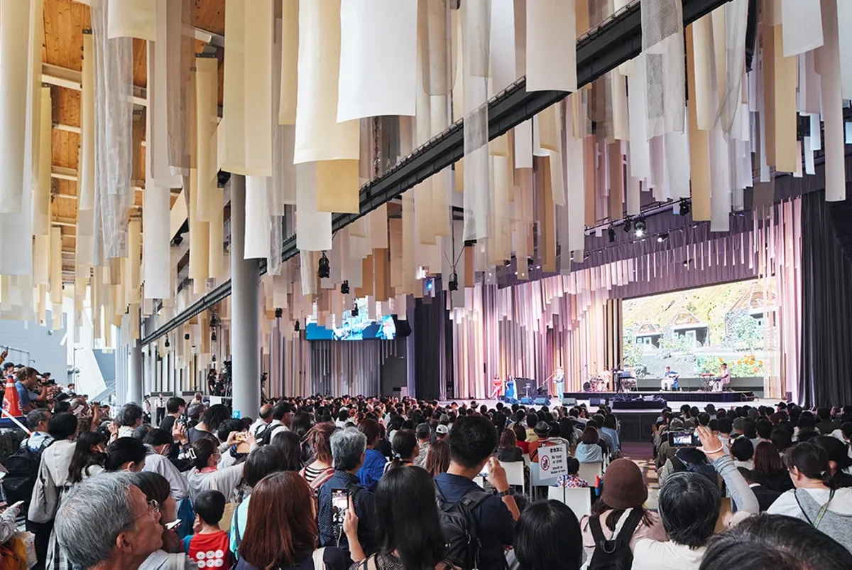 A crowd of people in a building.