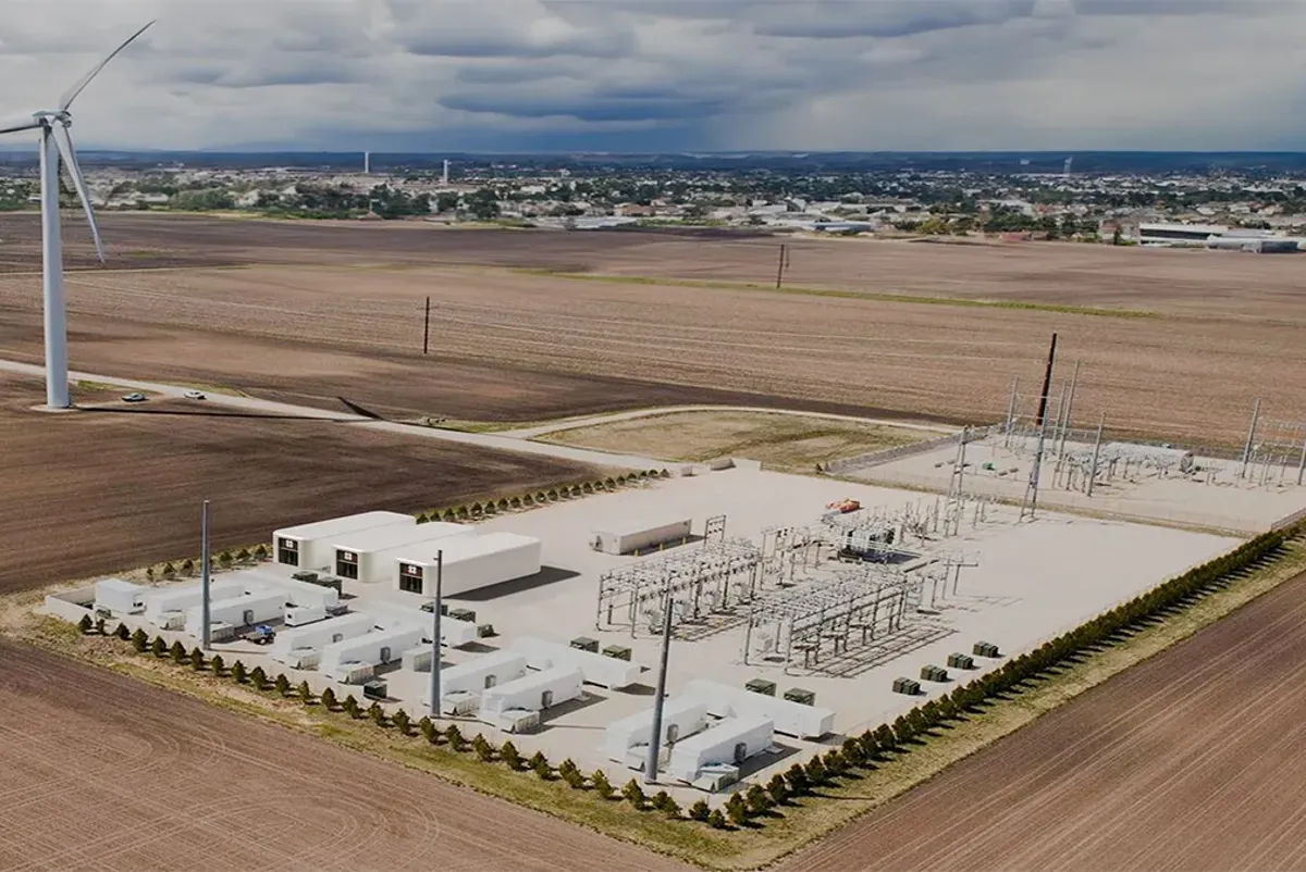 A large field with windmills.