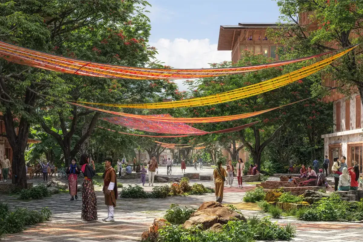 A group of people walking Gelephu Mindfulness City with colourful banners