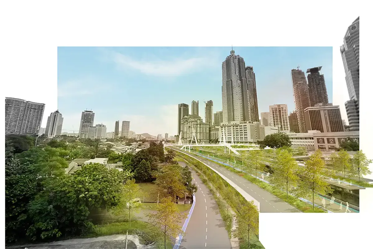 A city landscape with a road, green spaces and trees.