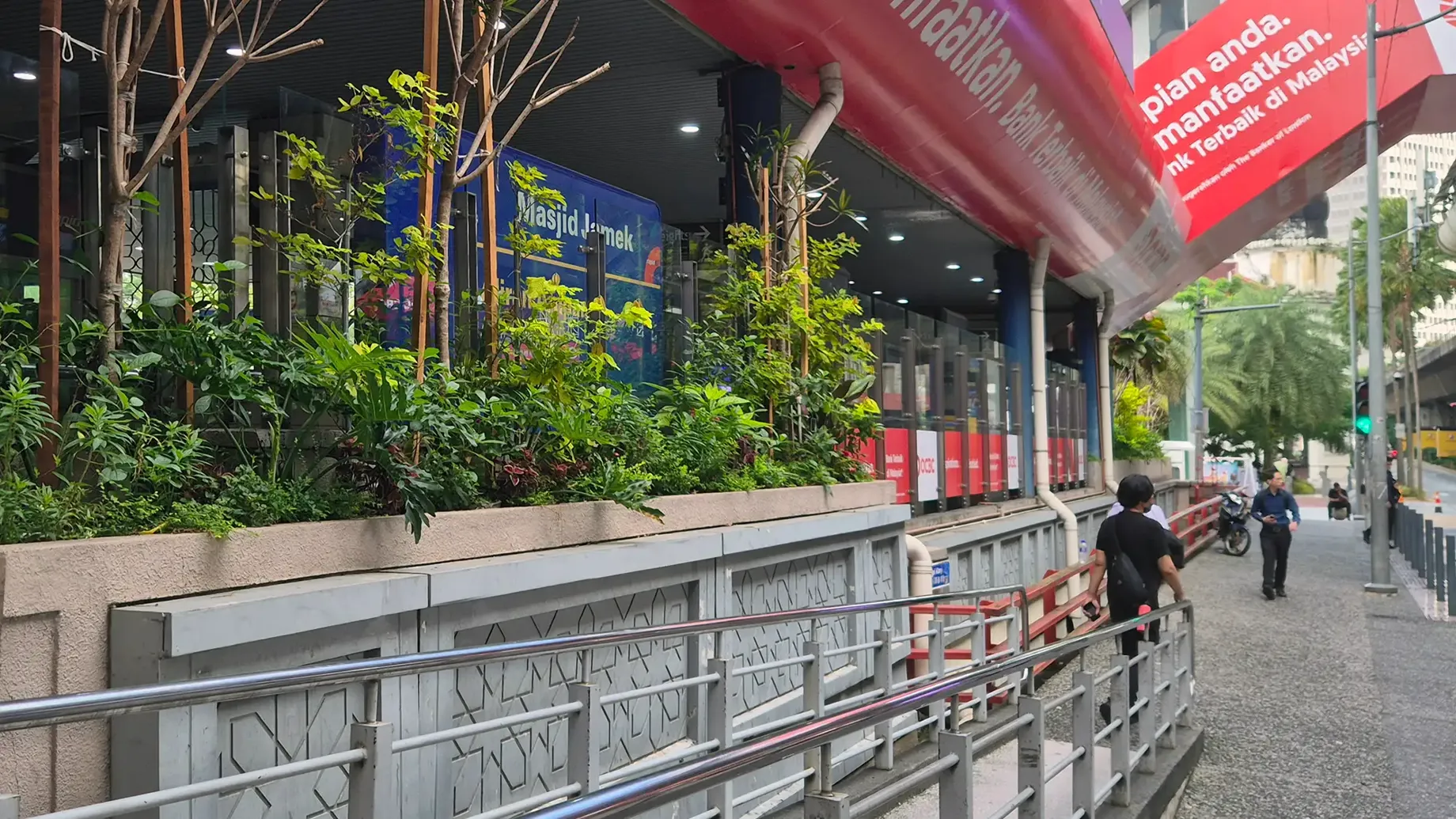City street with walkway and green plants and canopy