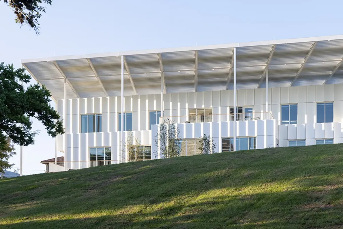A building with a grass lawn.