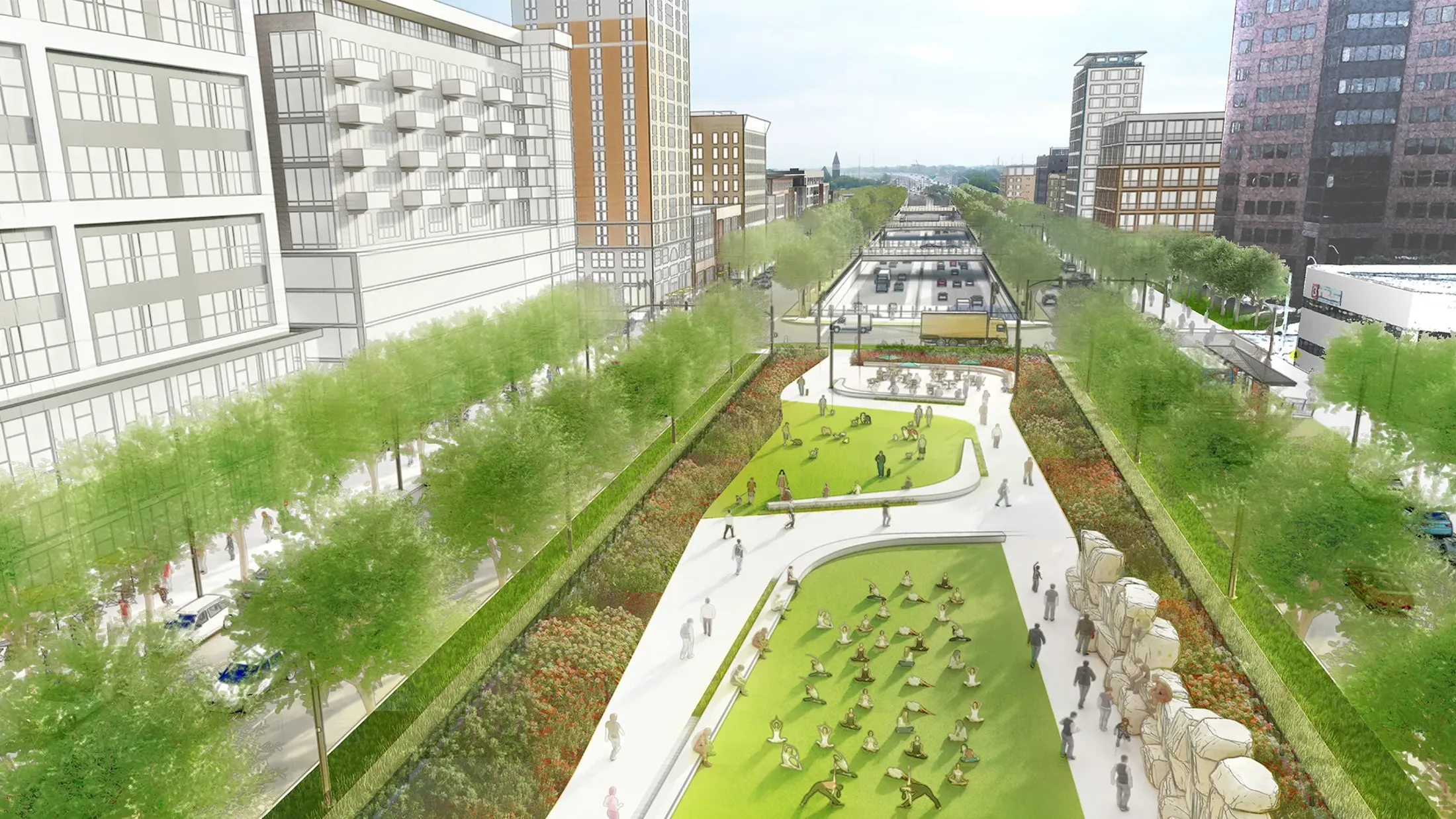 A large green space next to a recessed highway