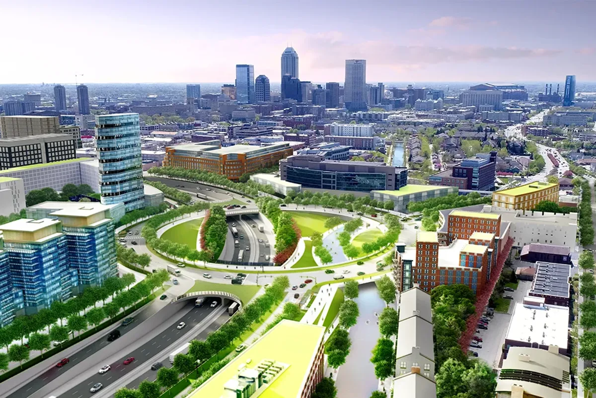 A greenway and recessed highway rendering with a downtown in the distance