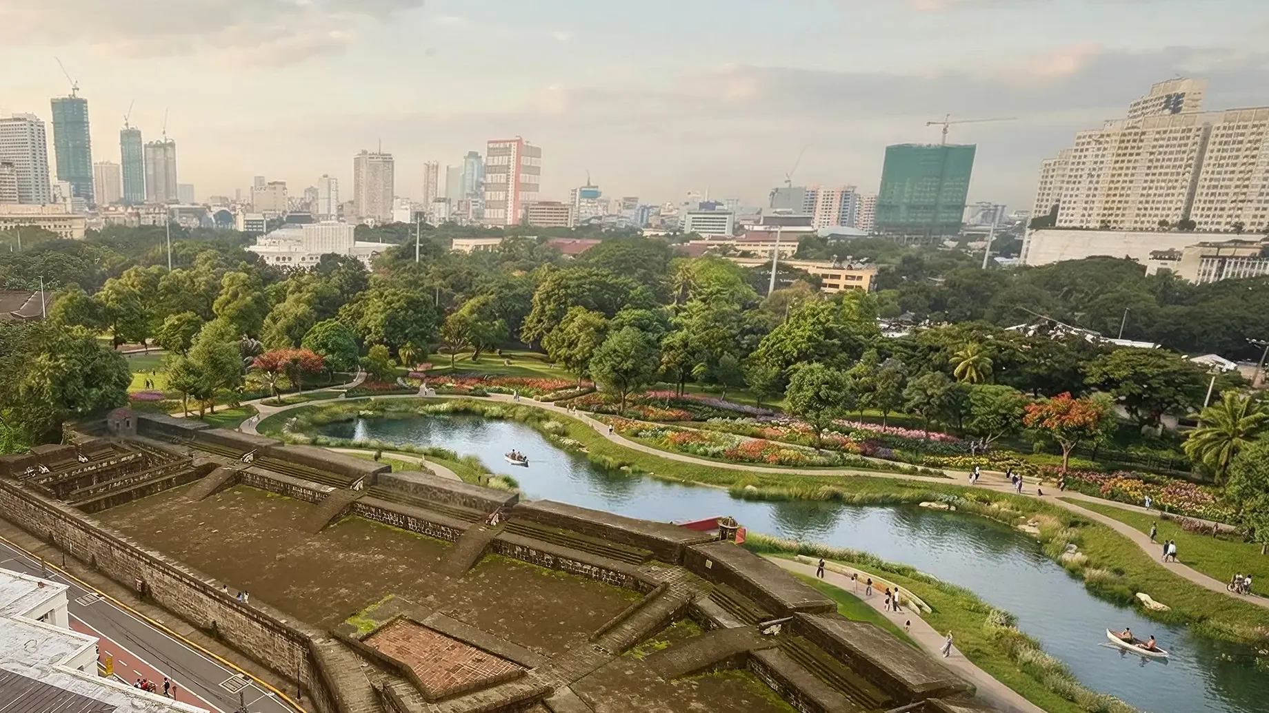 Artist illustration of aerial view of city over the historic Intramuros wall