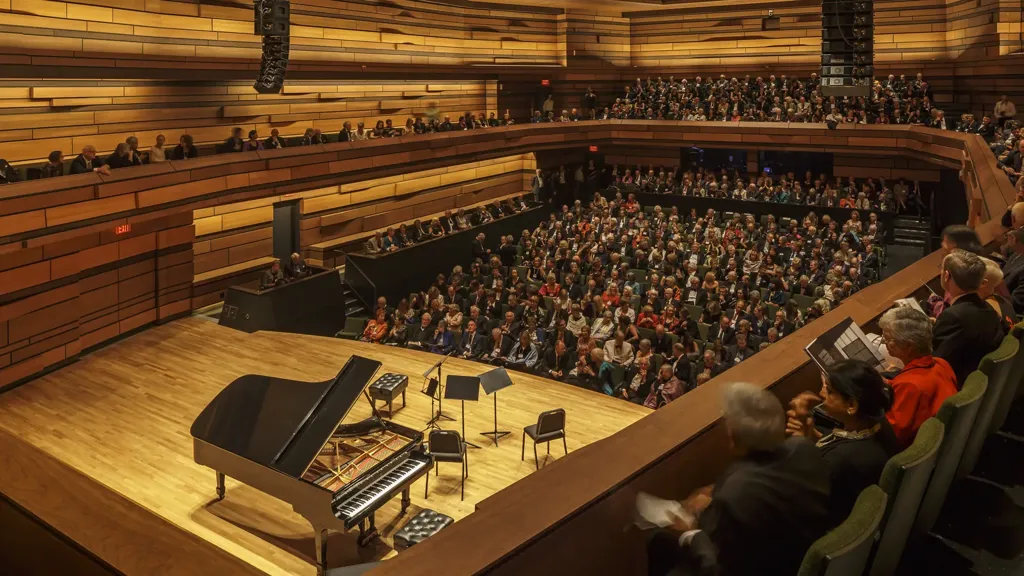 People seated inside the Isabel Bader Centre for the Performing Arts