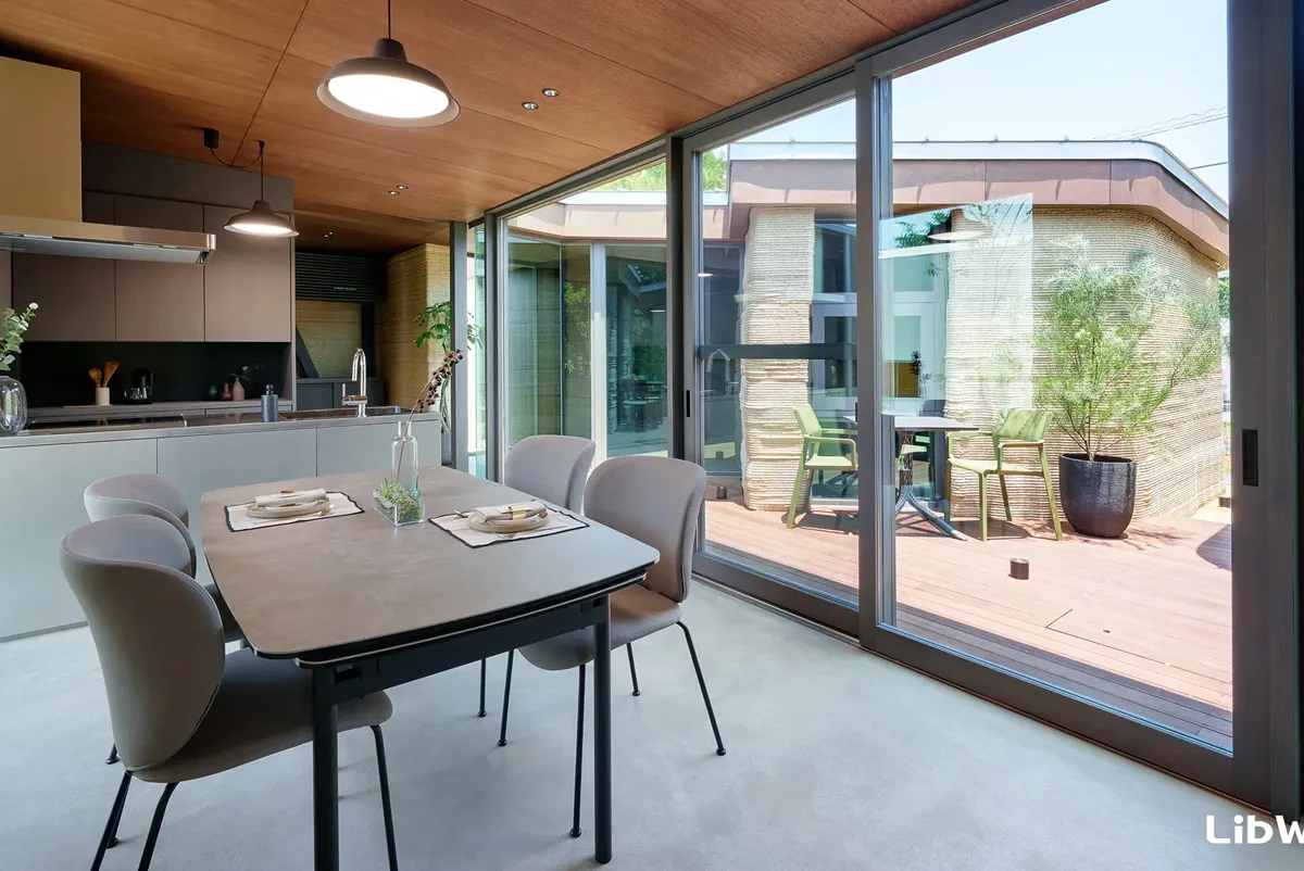 A table and chairs in a room.