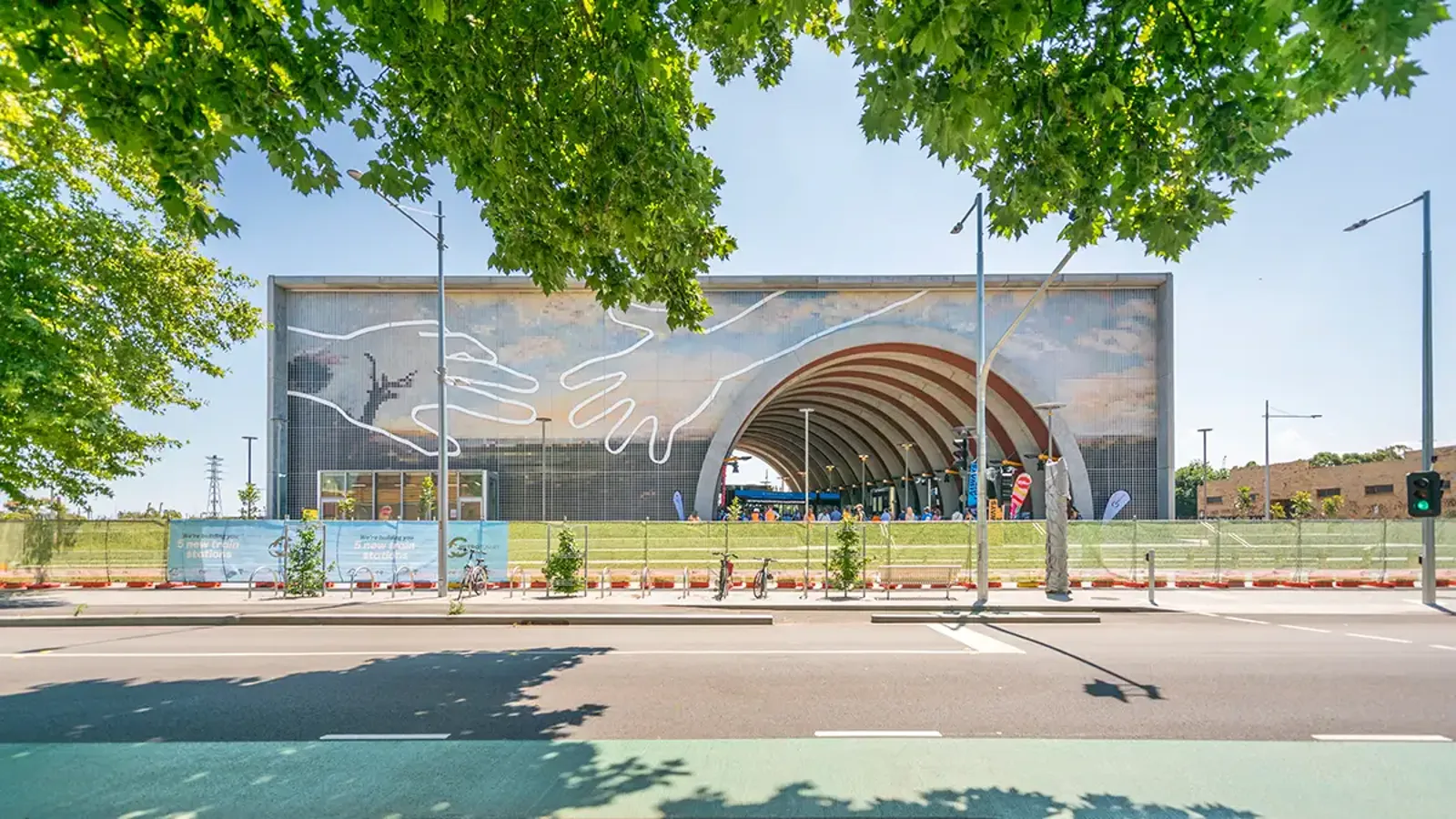 The building at Arden Station has a large tunnel section cutout and artwork on its exterior