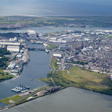 A river with a city in the background.