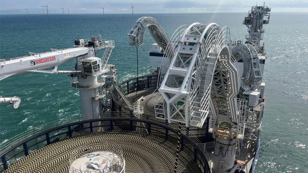A large ship with a large metal structure on it.