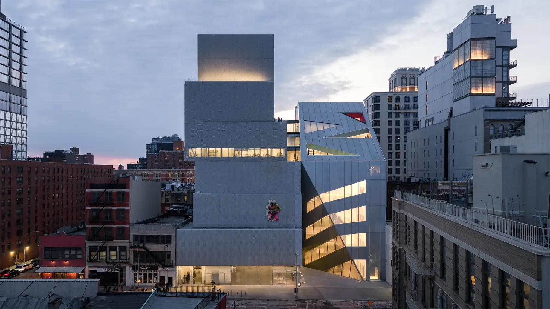 A group of buildings with a glass wall.