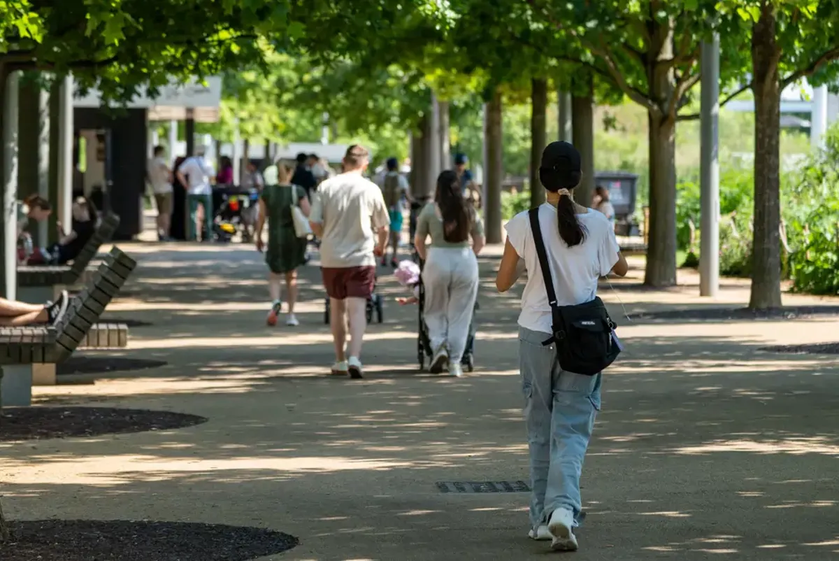 A person walking on a sidewalk.