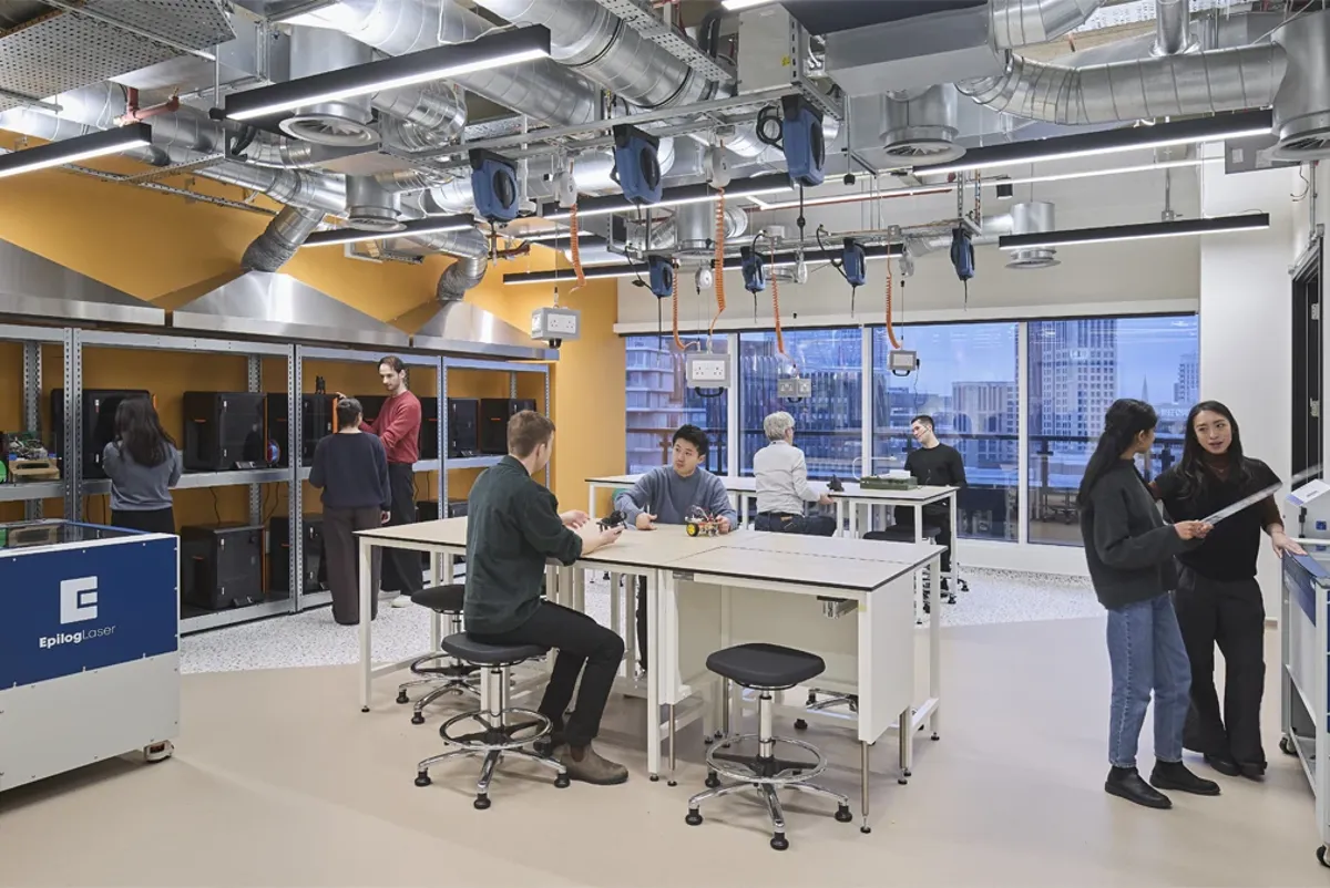 People in a room with machines.