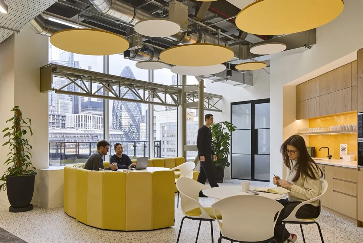 A group of people sitting around a table.