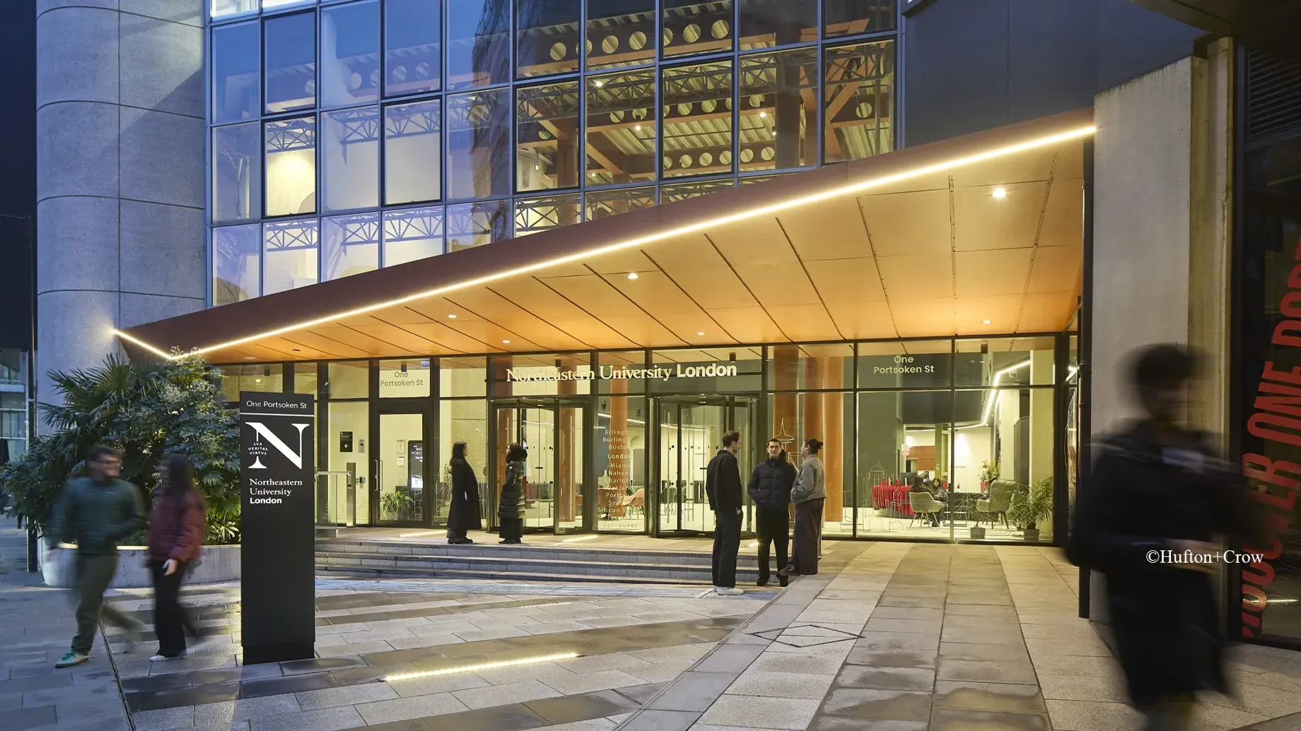 A group of people outside a building.