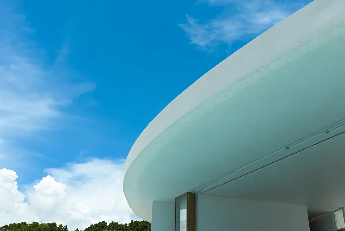 The distinctive white façade gently reflects the sunlight