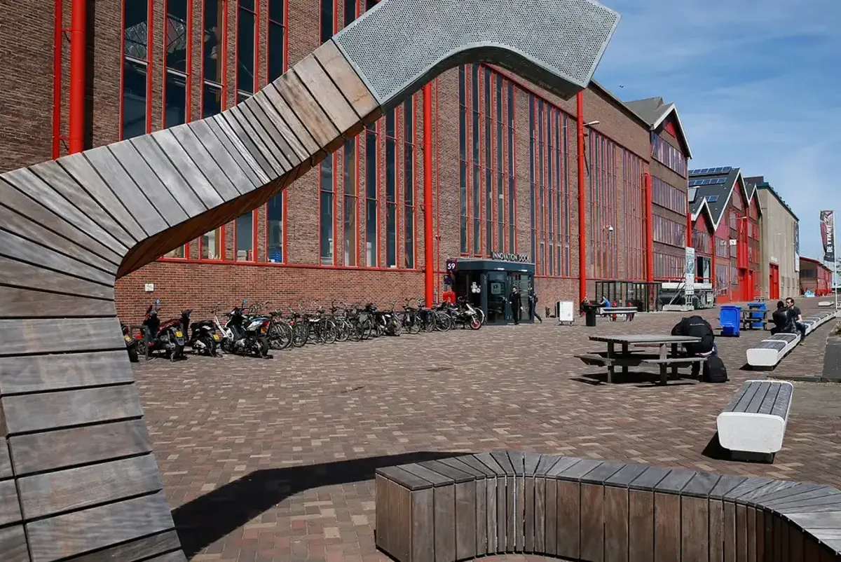 A building with a lot of bikes parked outside.