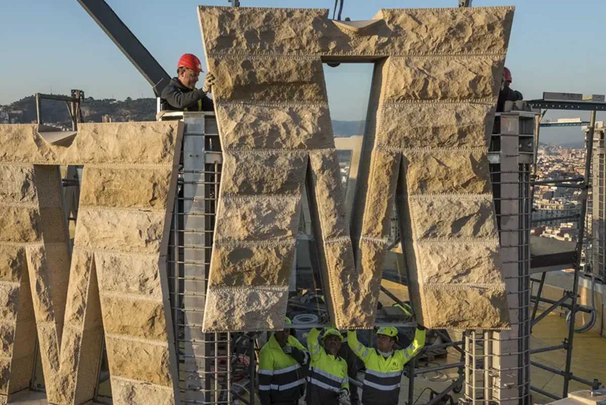 One of the stone panels being lowered into place