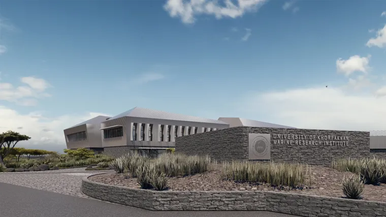 A building with a sign in front.