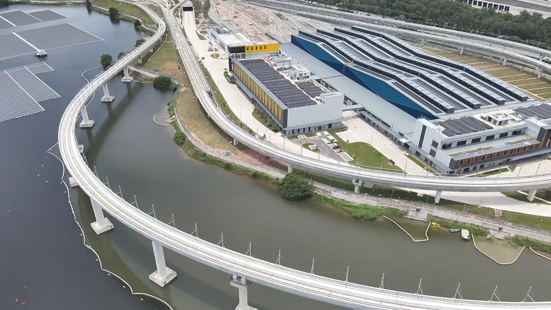 Rail tracks skirting around a central facility, built for train testing