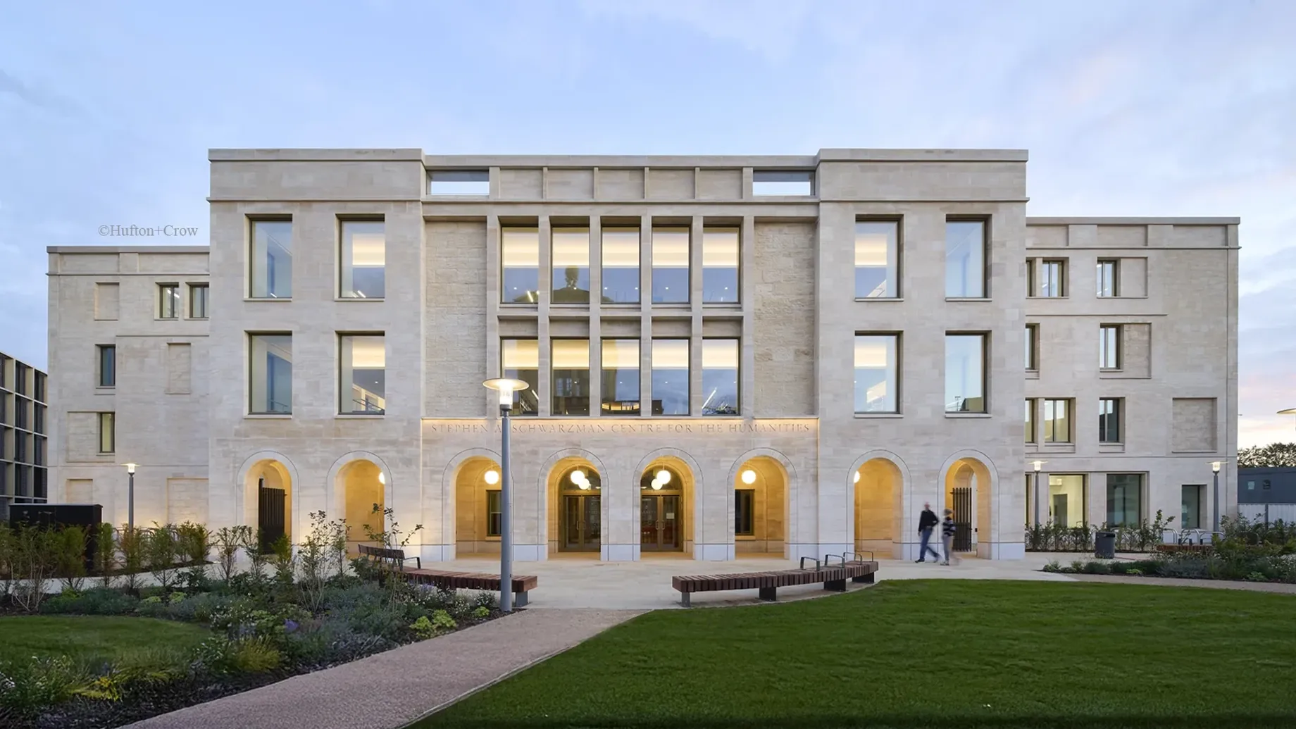 A large building with a lawn in front of it.