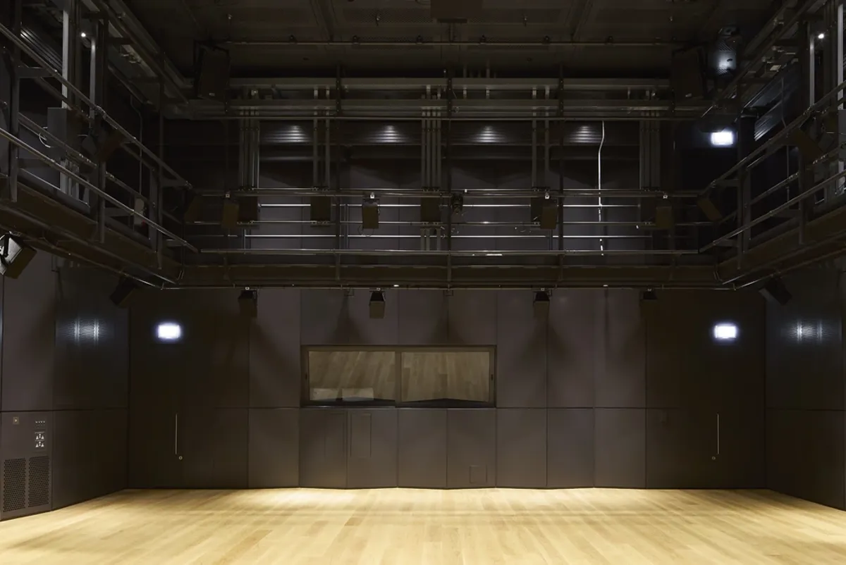 A room with a wood floor and a wood floor.