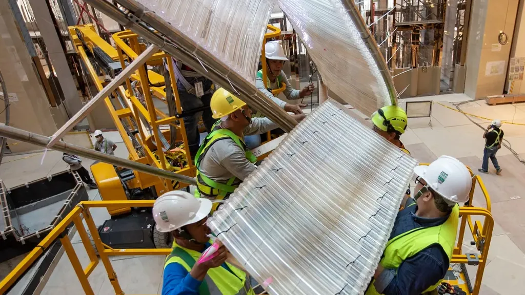 A group of people in hardhats working on a construction site.
