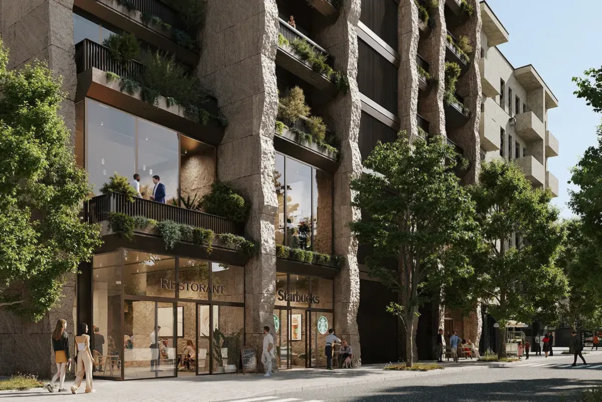 A building with trees and people walking around.