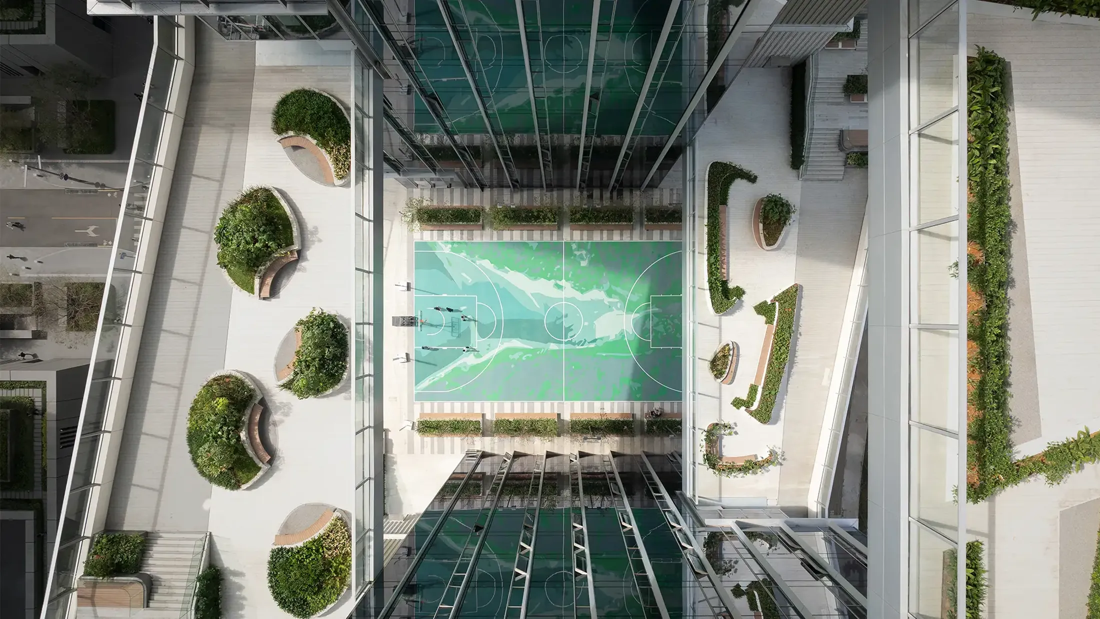 30 storey exposed atrium with basketball courts below