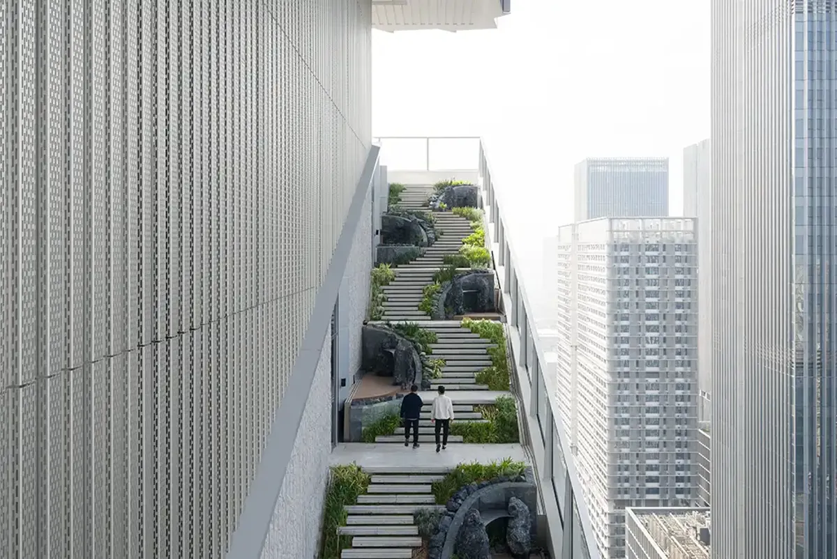 The landscaped walkway features trees, steps, gardens and viewpoints