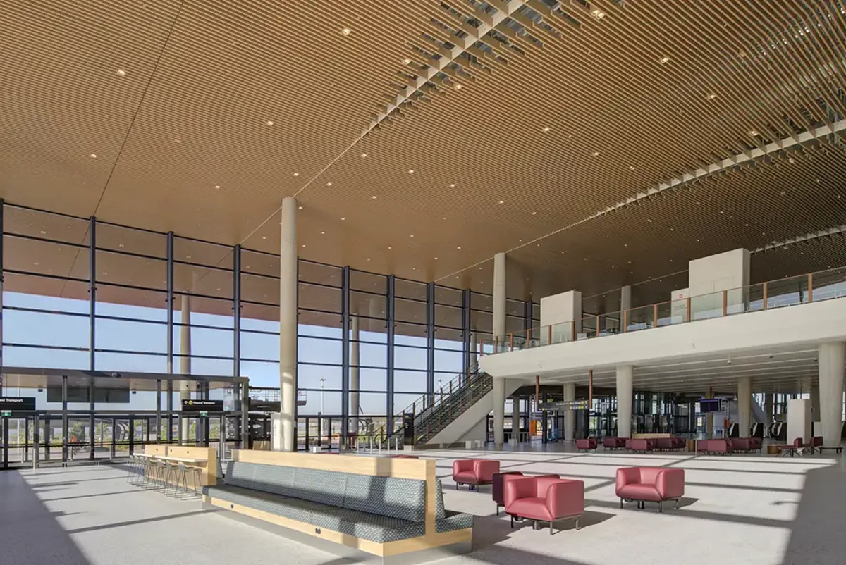 Large space with red chairs inside Western Sydney International airport