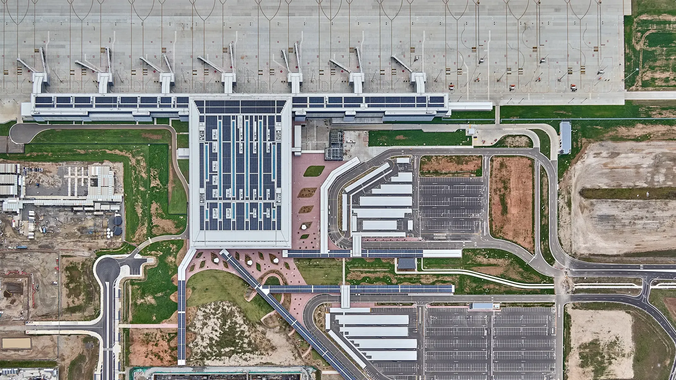 Aerial view of Western Sydney International including gates and buildings