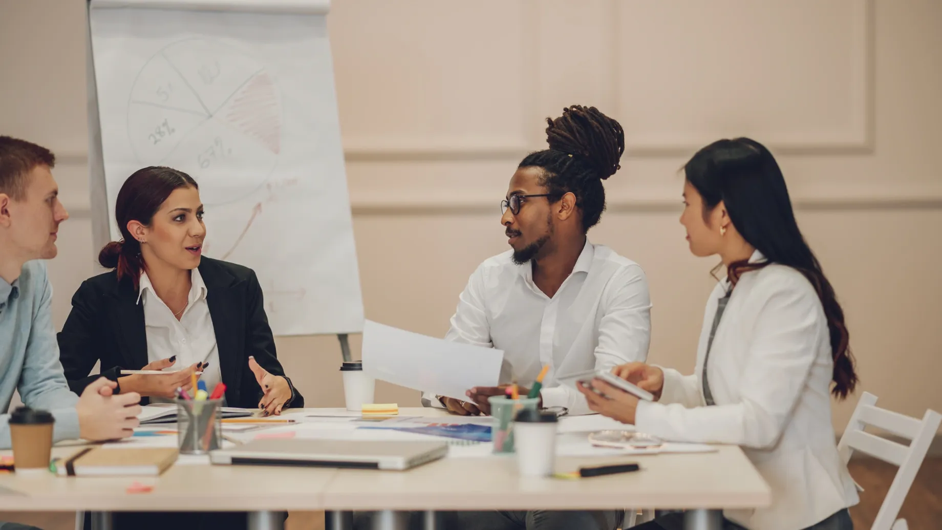 A group of people sitting around a table.