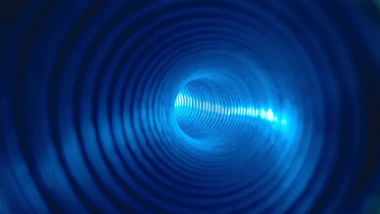 A blue circle with a light in it.